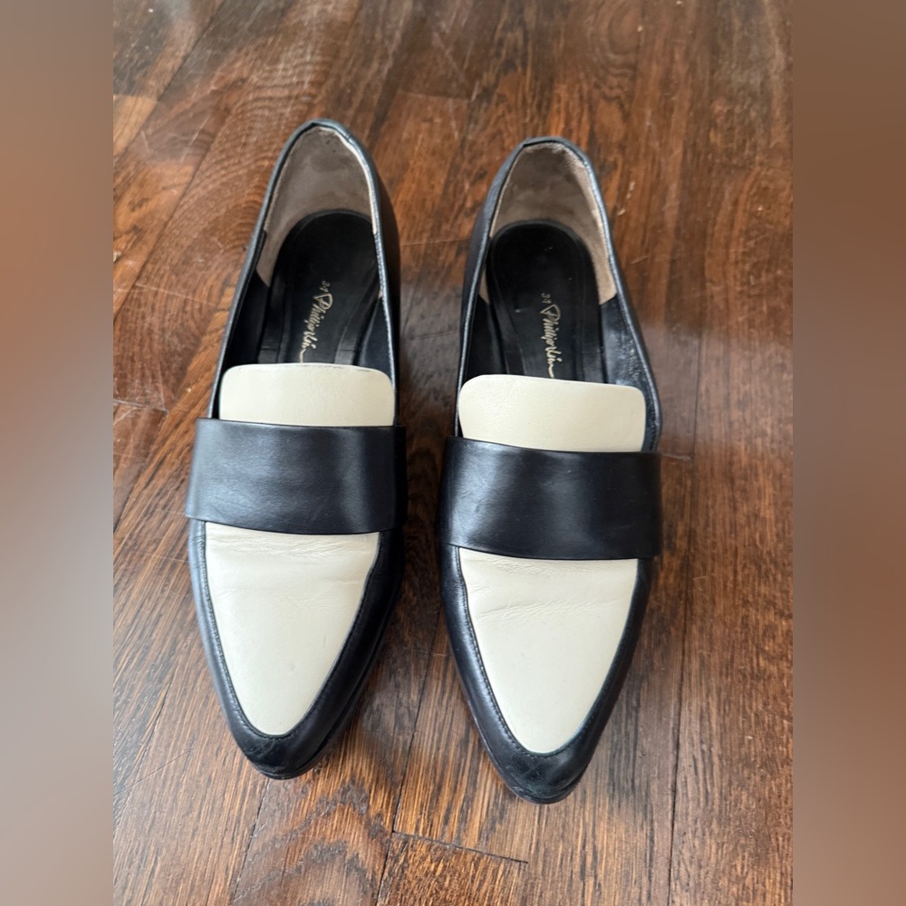 3.1 Philip Lim leather black and white loafers.